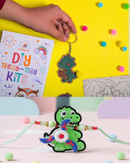 Dino Rakhi Combo – DIY Dinosaur Painting Kit with Dino Keychain, Fridge Magnet, Canvas Painting & Dino Rakhi