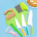 Plastic Knife Set with Toddler Knife, Peeler, Cookie Cutter, and Cutting Board (Random Color) - Montessori Skills