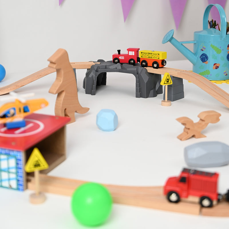 Playbox The Dino Land-Second Set-1 Plastic Bridge,2 Plastic Attachment,2 Dinosaurs,2 Stones,1 Helicopter,1 Helicopter Pad,1 Fire Extinguisher,2 Signals,15 Tracks.