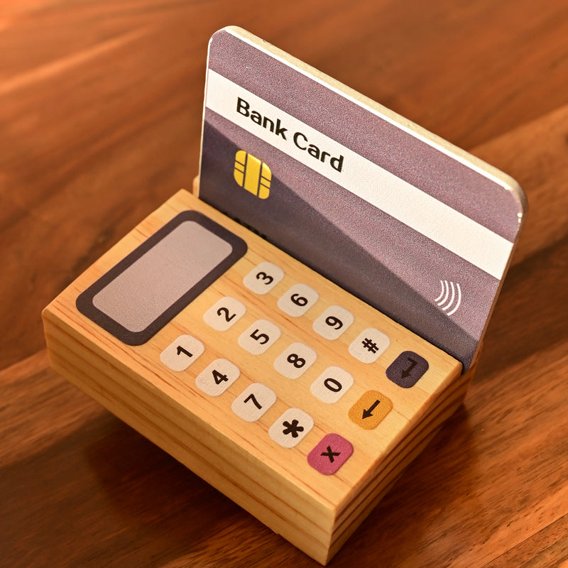 Playbox Funny Money - Cashier - Wooden Toy 1 Cashier, 6 Coins, 1 Credit Card, 1 Card Machine, 1 DIsplay.